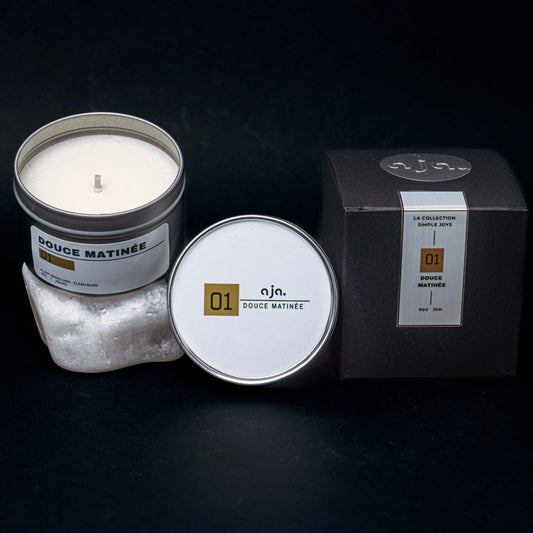 Handmade vegetable wax scented candle in a metal travel tin