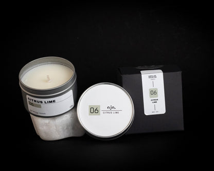 Candle with packaging on a black background