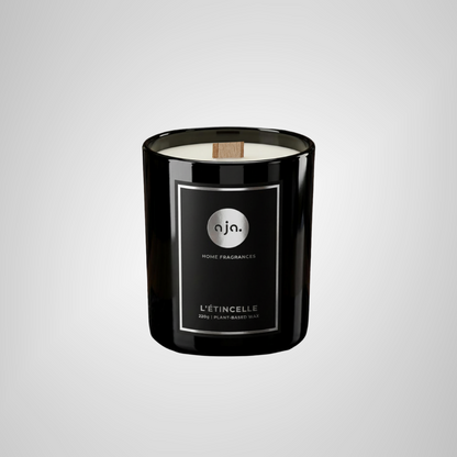Black candle with a label on a light gray background