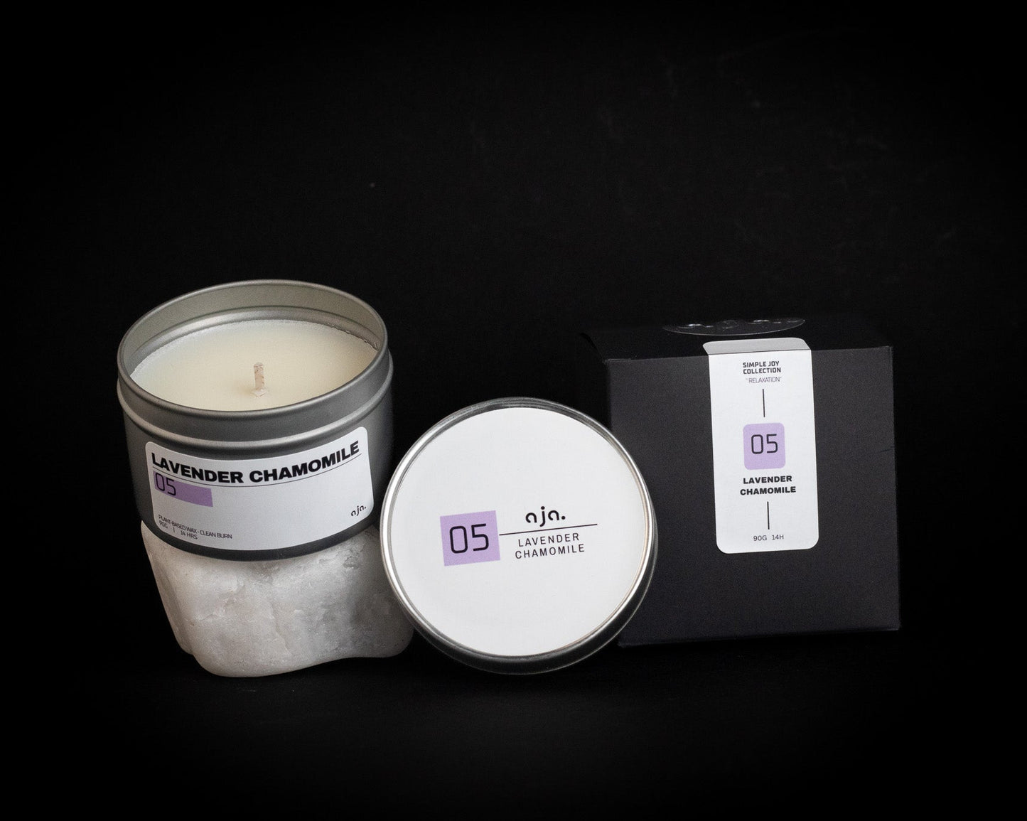 Lavender Chamomile candle with packaging on a black background