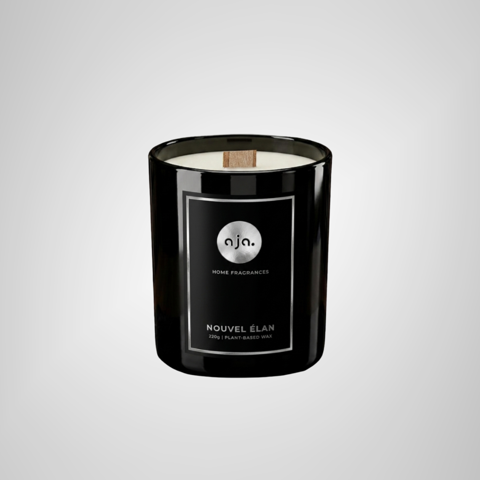 Black candle with a label on a light gray background