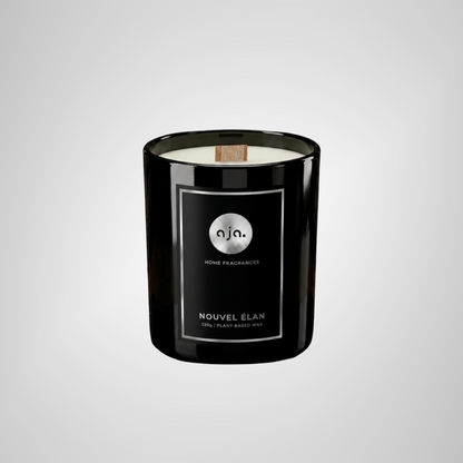 Black candle with a label on a light gray background