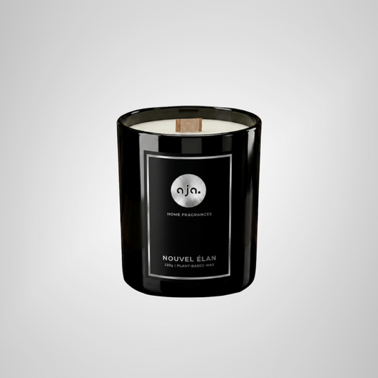 Black candle with a label on a light gray background