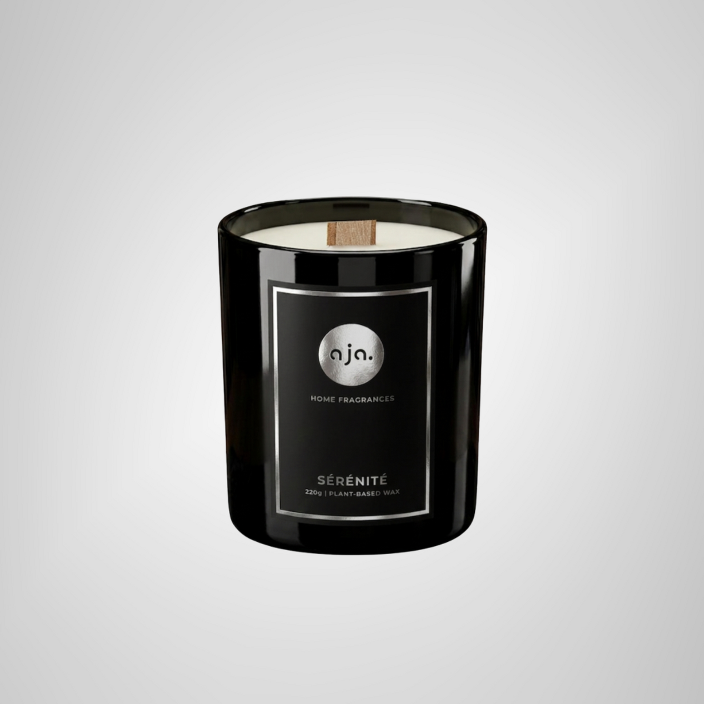 Black candle with a label on a light gray background