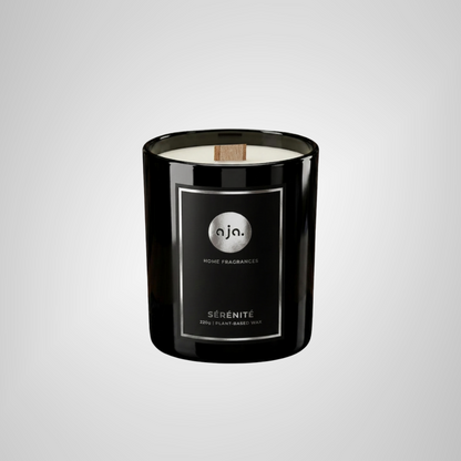 Black candle with a label on a light gray background