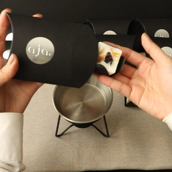 Product packaging demo of wax melt cube with botanical on top